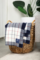 Vintage red, white, and blue plaid merino wool blanket